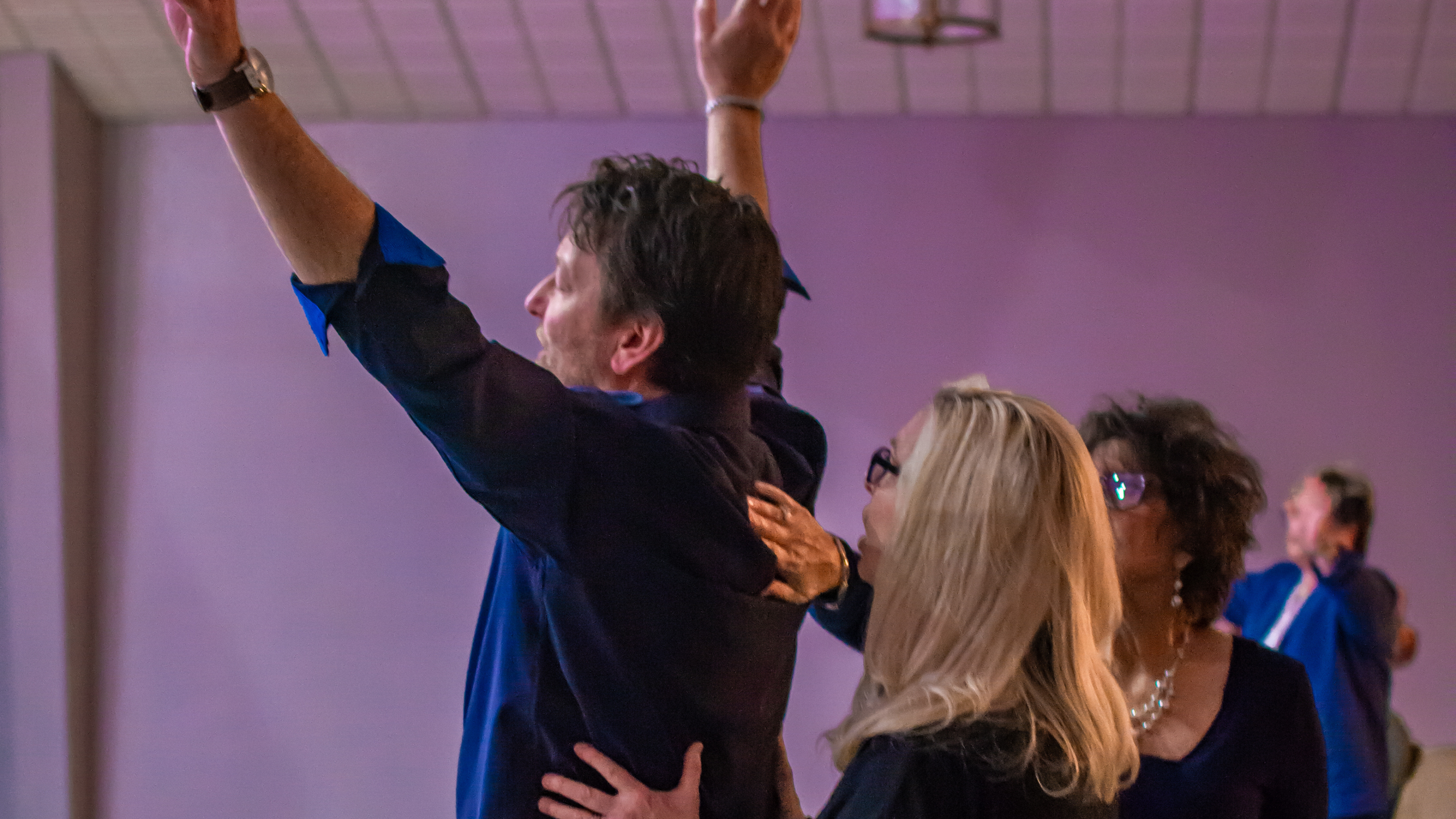 22 men touching each other's foreheads