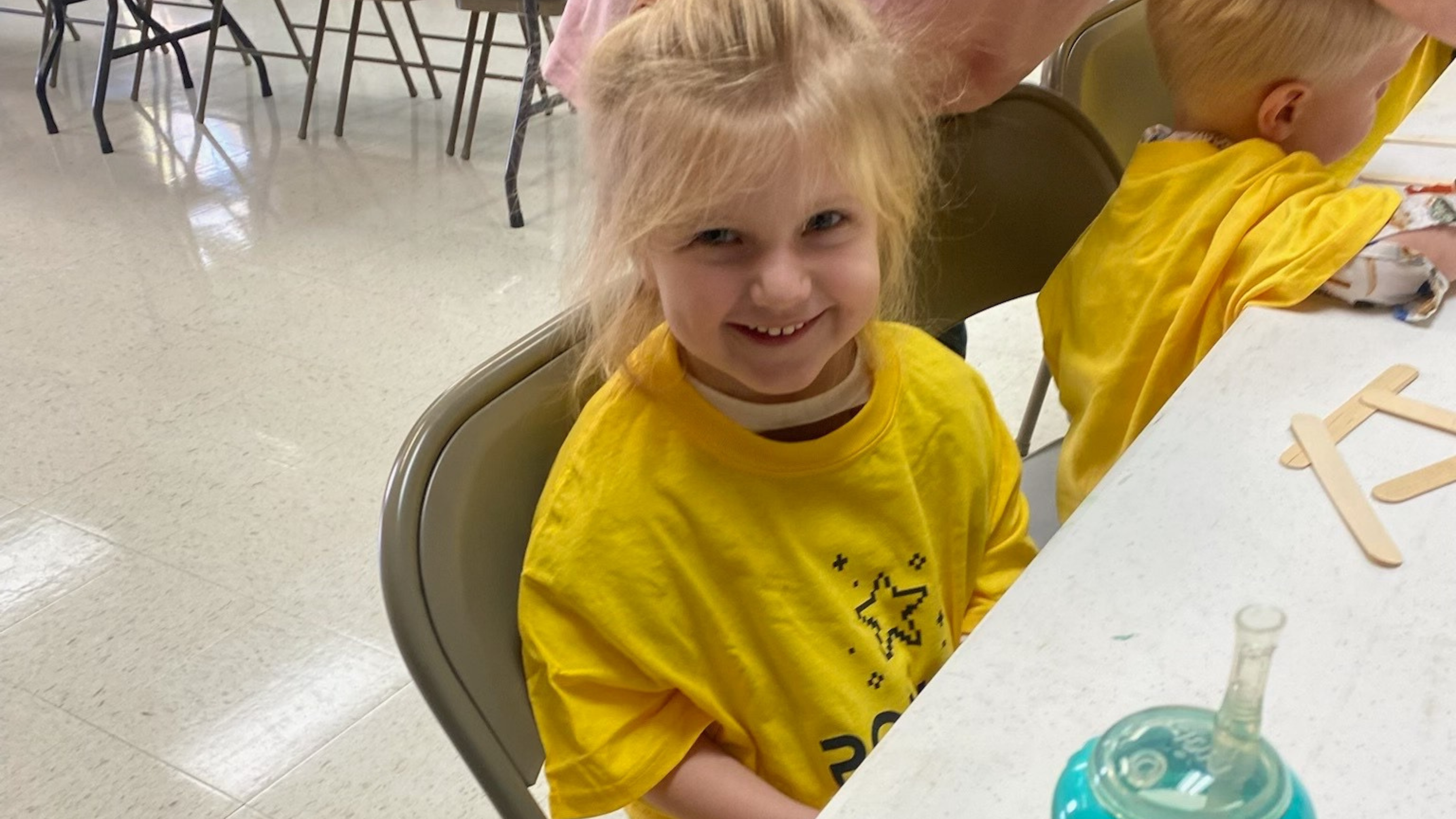36 a child is drawing on a piece of paper
