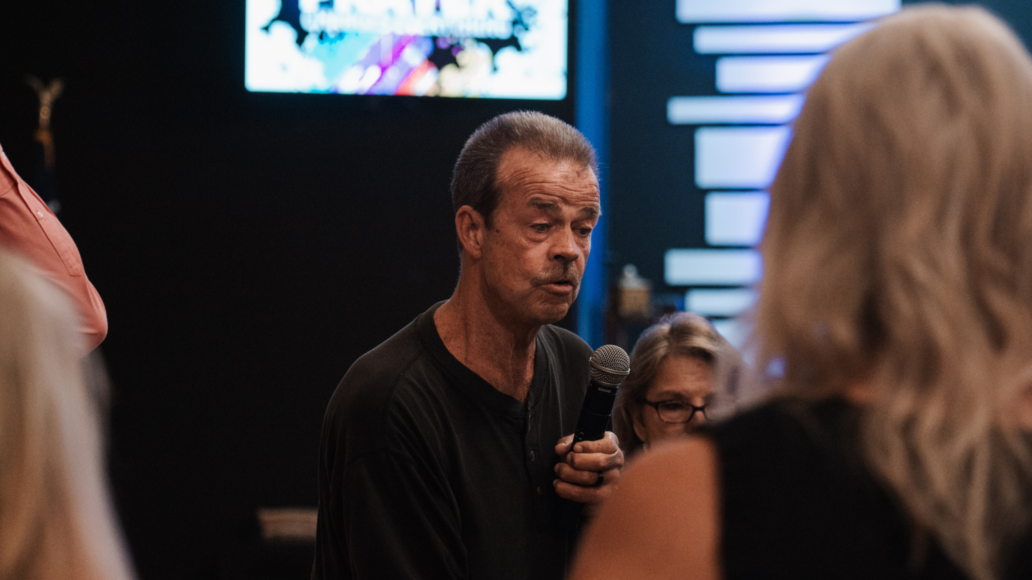 portrait photography of man wearing black suit jacket